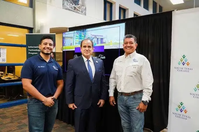 Frontier staff with a South Texas College representative at a community outreach presentation