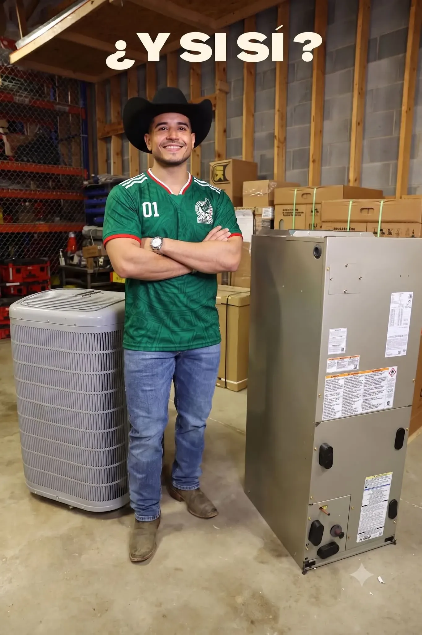 Jay Villegas between a new condenser and air handler in the Frontier warehouse