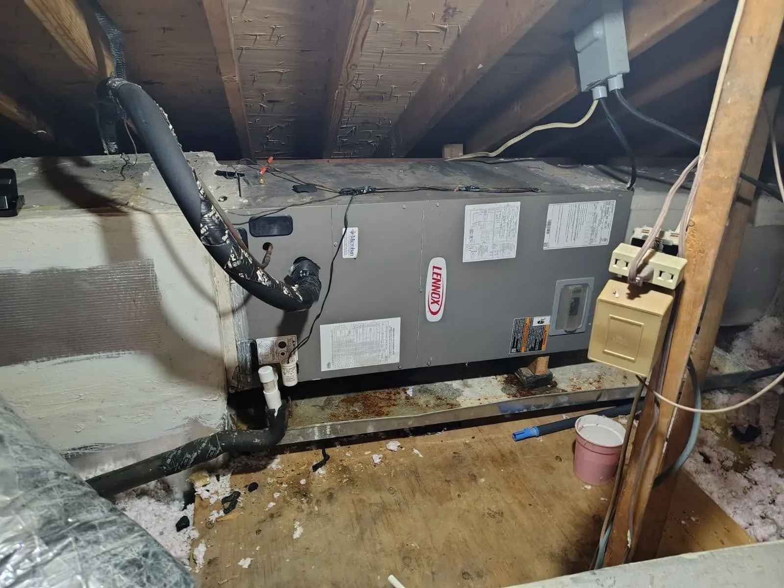 Lennox horizontal air handler in a residential attic before service