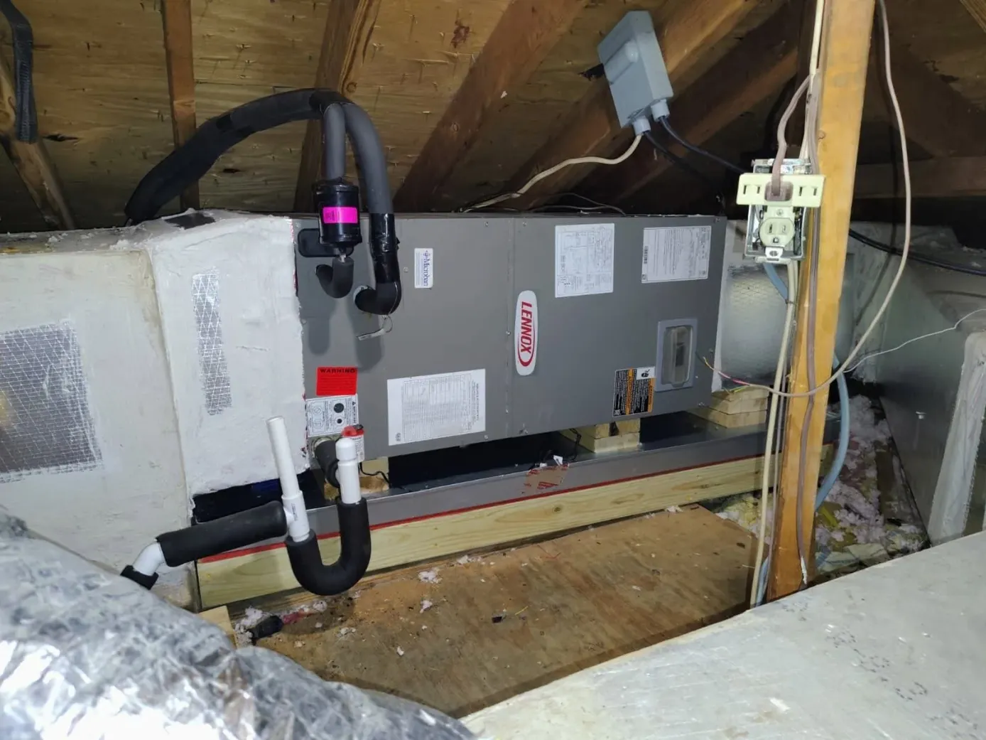 Lennox attic air handler after service with a new PVC condensate trap and drain line